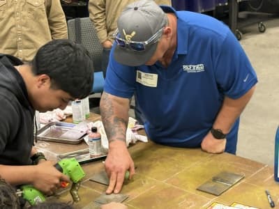 Technicians collaborating during hands-on NDT training